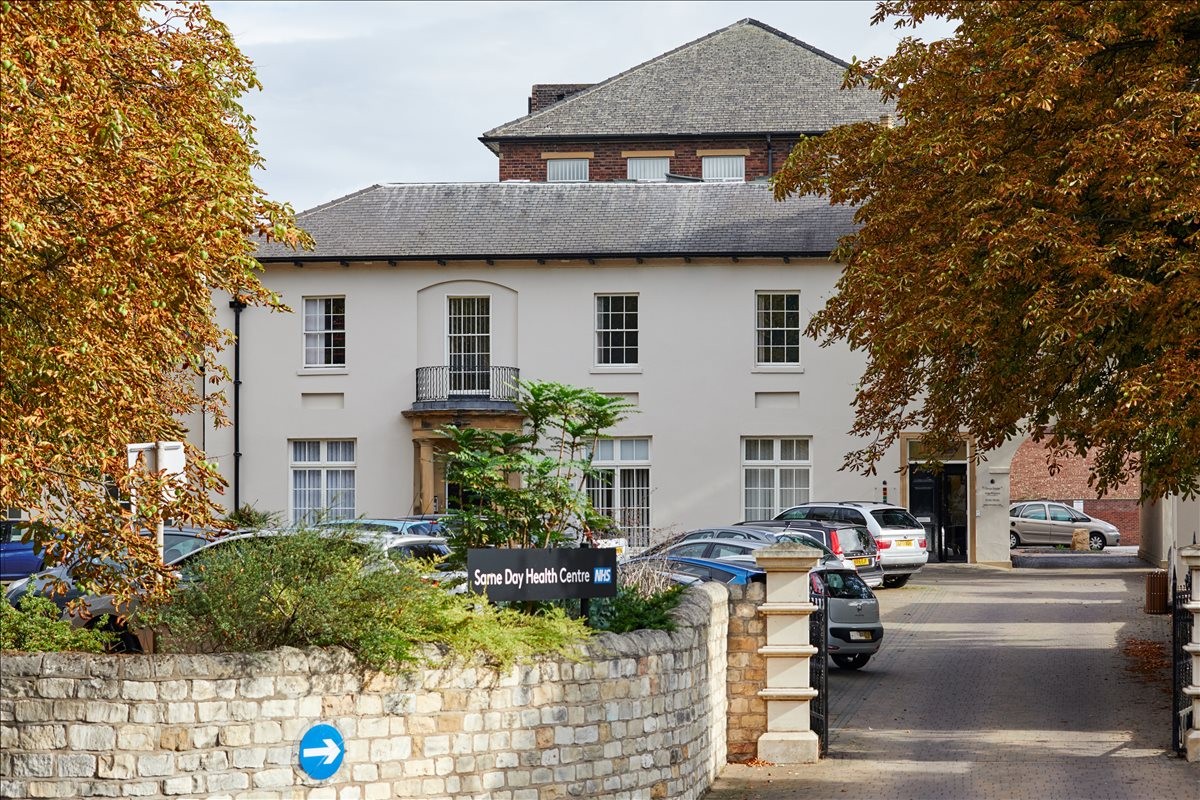 Exterior view of the white facade and entrance of 1 Cavendish Court, South Parade, Doncaster.