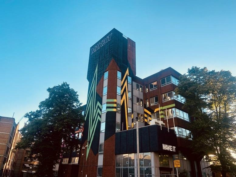 Exterior view of the colorful mural-covered building at 15 Linton Road.