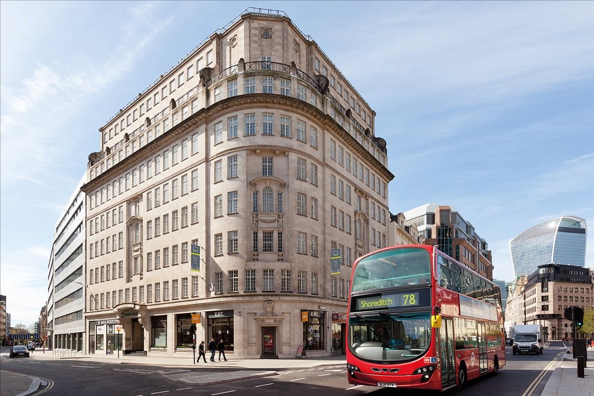 Exterior view of the historic stone facade at 155-157 Minories, Portsoken House, London.