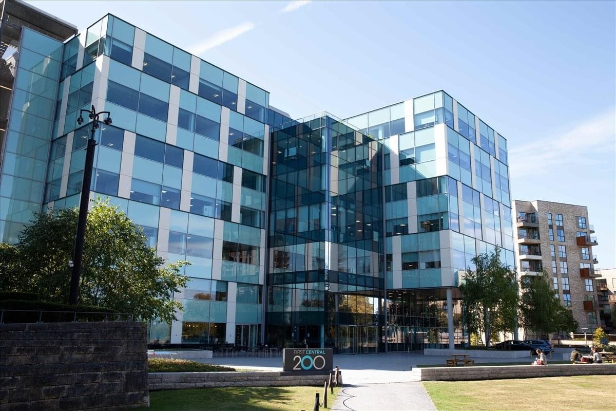 Exterior view of the glass-facade building at 2 Lakeside Drive.