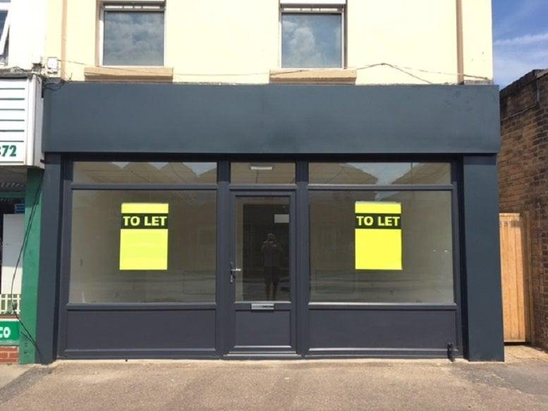 Exterior view of the dark grey storefront at 333 Holdenhurst Road, Bournemouth.