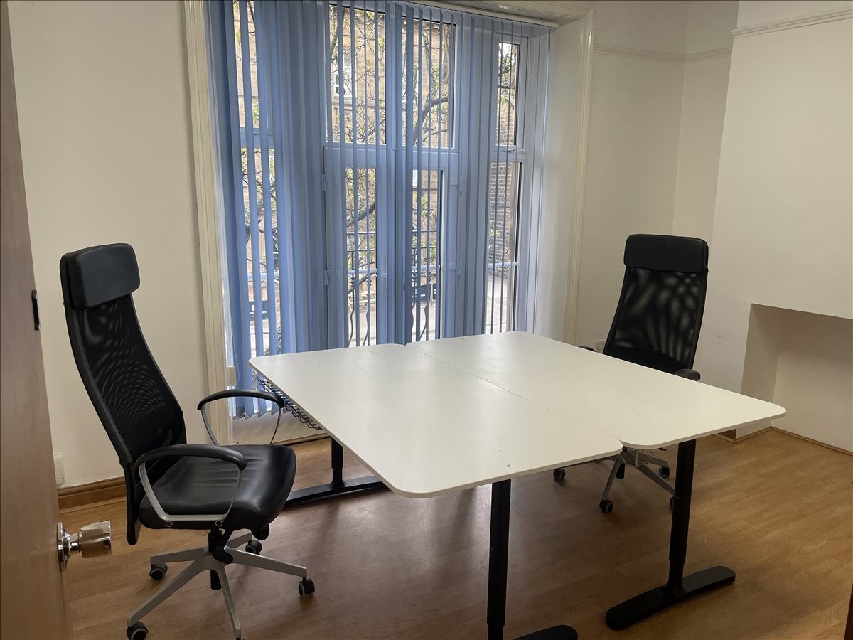 Spacious two-person office suite at 41A Brook Street with height-adjustable desks and natural light.