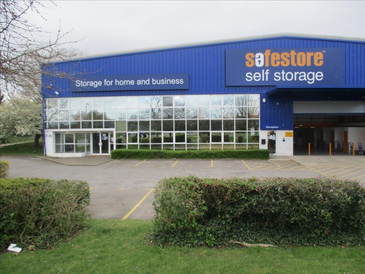Exterior view of the blue Safestore building at 572 Ipswich Road with glass front and parking area.