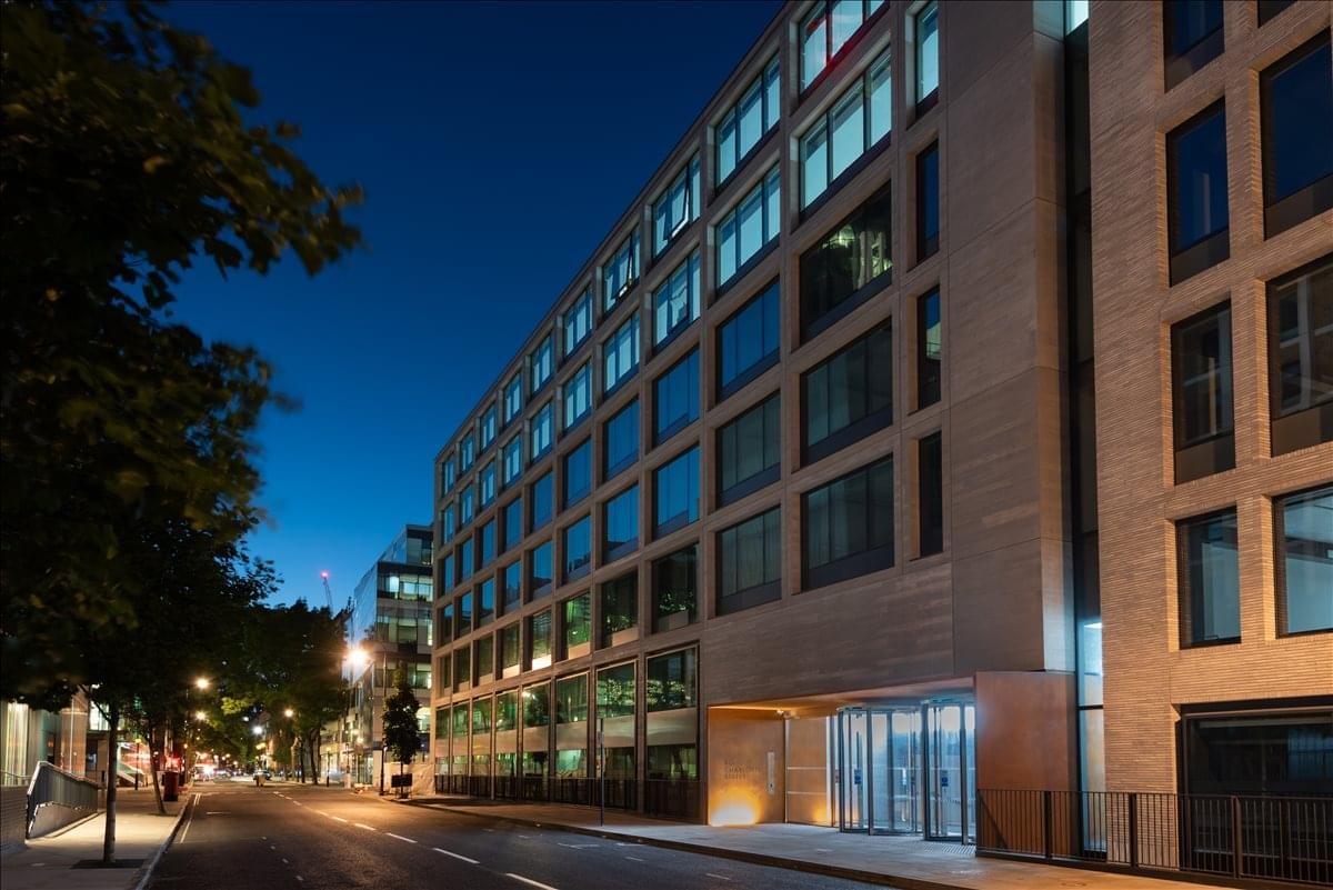 Exterior view of the contemporary facade and street-side entrance of 80 Charlotte Street.