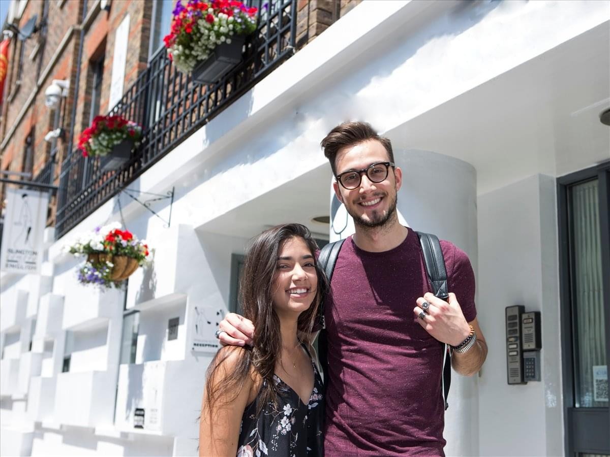 Exterior view of the white facade entrance at 97 White Lion Street.