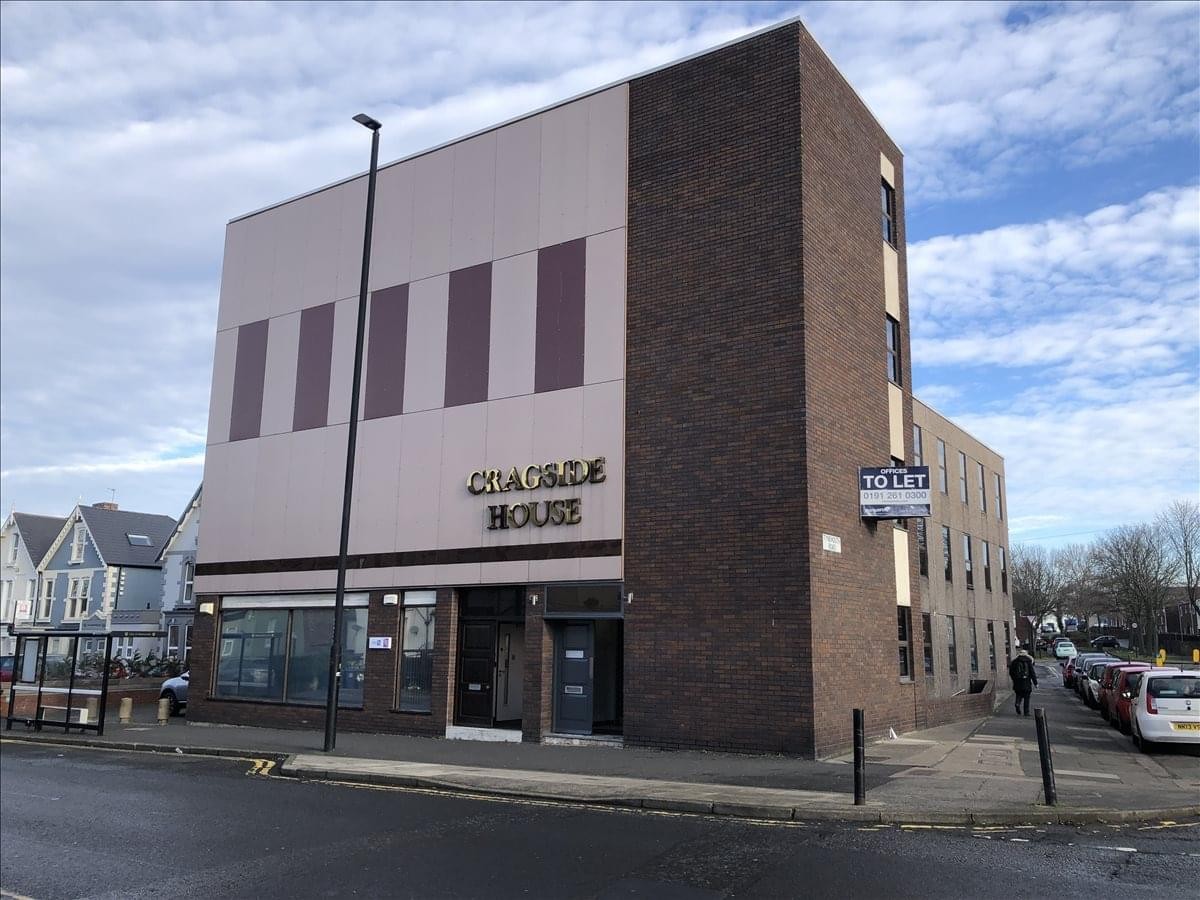Exterior view of the multi-storey brick and tan facade at Cragside Business Centre.