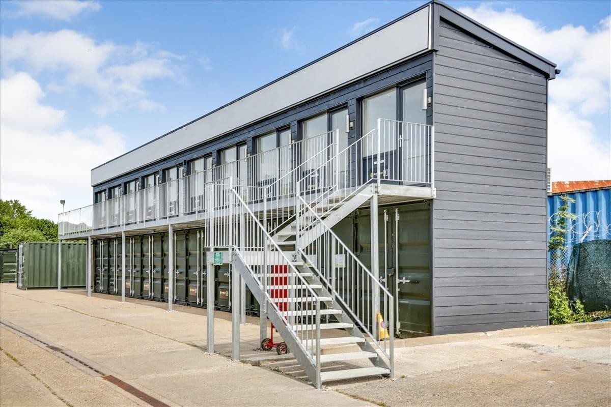 Exterior view of the modular, two-story Deal Enterprise Centre building with an external metal staircase.