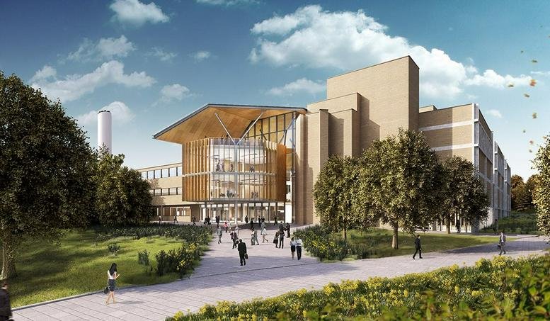 Exterior view of the Glasshouse building at Alderley Park featuring a modern glass entrance and wooden accents.