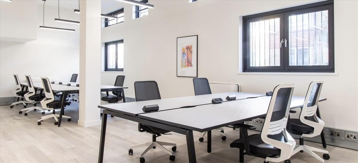 Spacious open-plan workspace at Hatchers Yard, 2nd Floor, Unit B6, featuring multiple desks and ergonomic chairs.