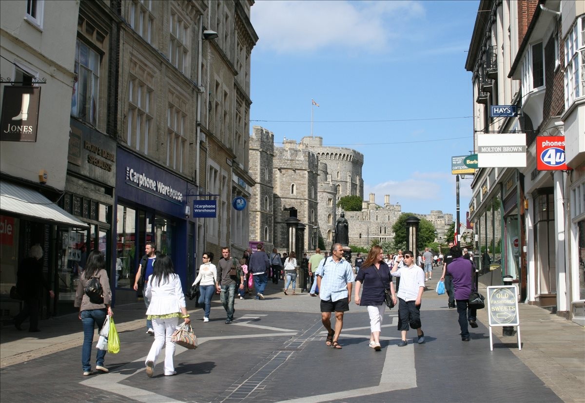 Street view of High Street, Dukes House looking towards the historic stone towers of Windsor Castle.