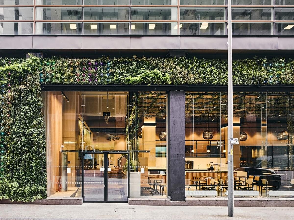 Exterior view of the modern facade and glass entrance at Lowry House, 17 Marble Street, Manchester.