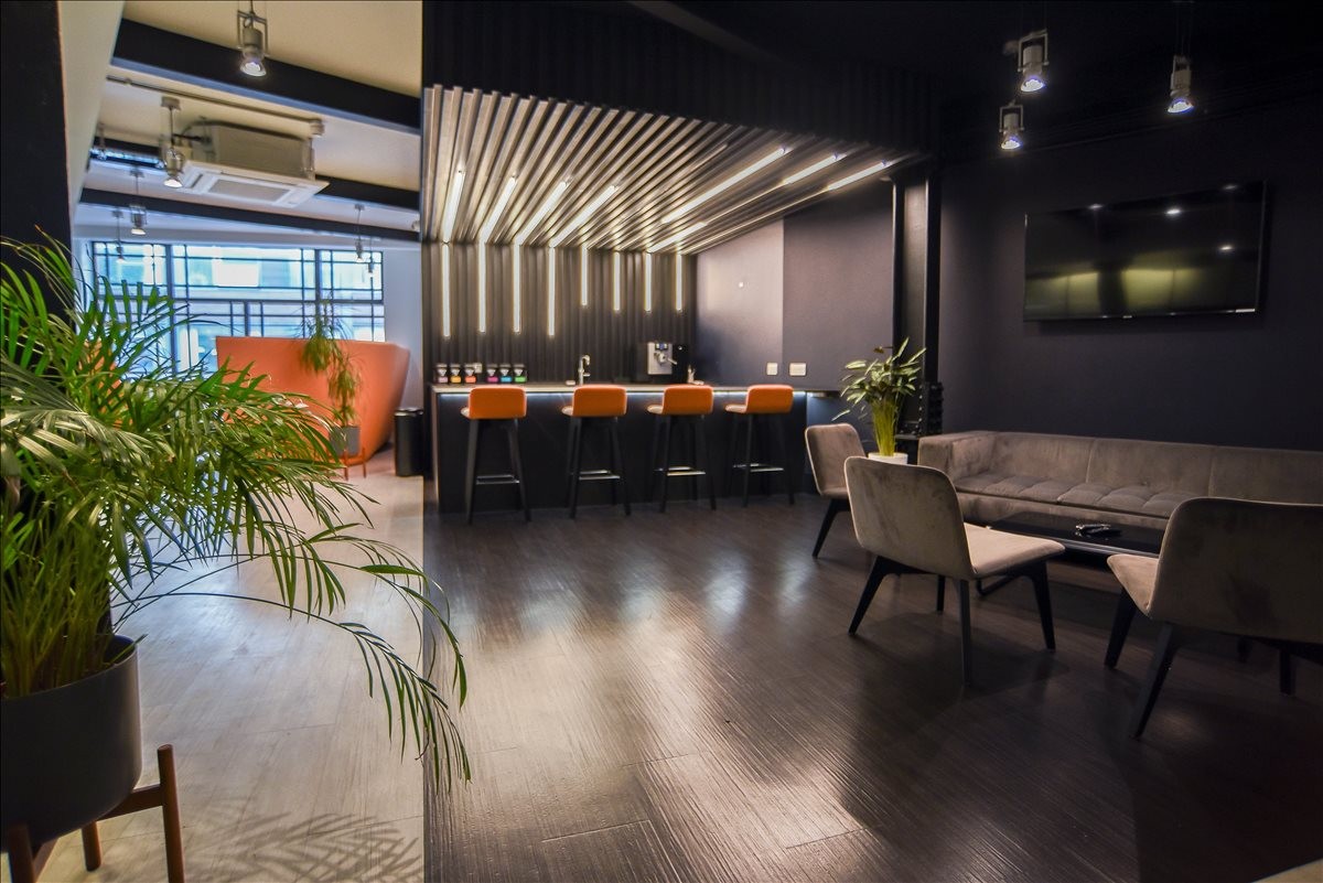 Spacious lounge at Parsonage Chambers, 3 Parsonage, with a designer bar, plush seating, and warm accent lighting.