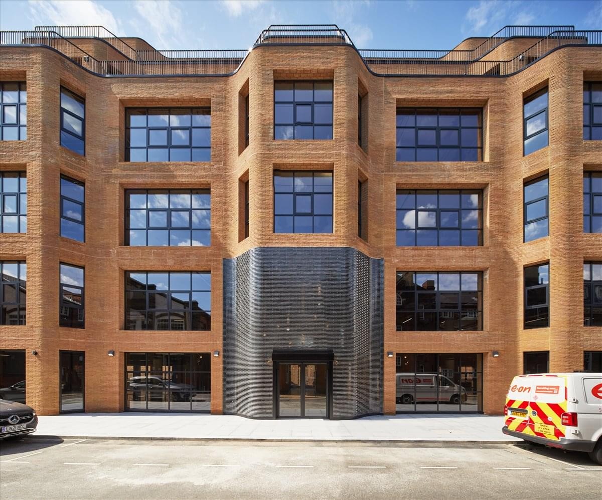 Exterior view of the brick facade and metal entrance at Southworks, 14-21 Rushworth Street.