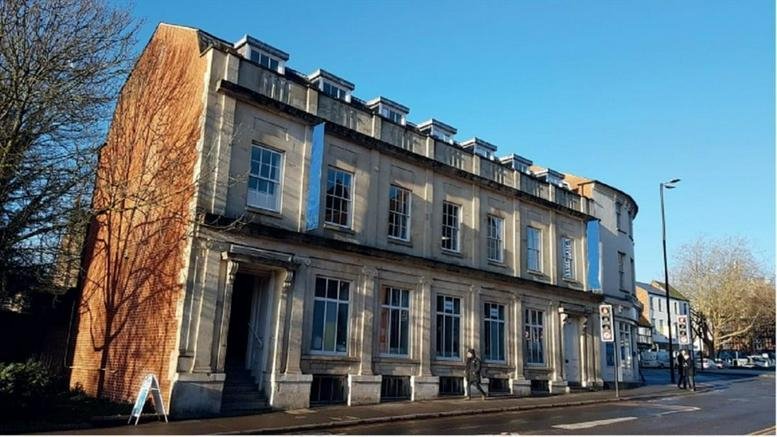 Exterior view of the historic stone facade at 2-10 Bridge St.
