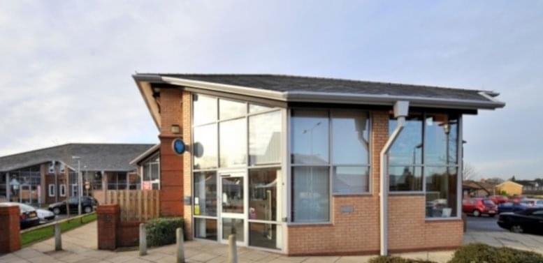 Exterior view of the modern glass and brick facade at Balfour Court, Hough Lane.