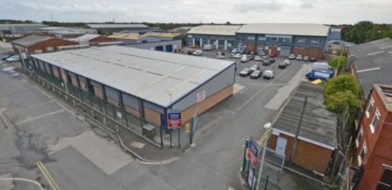 Aerial view of the industrial units at Clifton Trade Park, Brinwell Road, showing grey-roofed buildings and parking.
