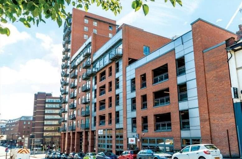Exterior view of the contemporary red brick Metis Building on a sunny day.