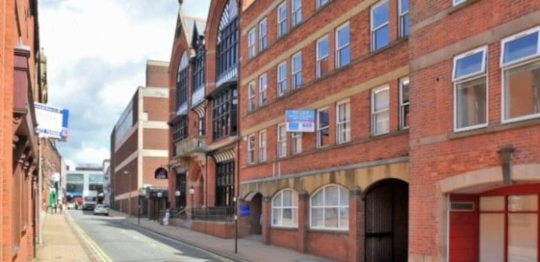 Exterior view of the red brick facade at The Chambers, Guildhall Street, Preston.