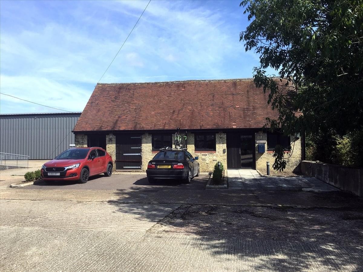 Exterior view of the traditional brick building at Tile Barn, Manor Farm, Milton Road.