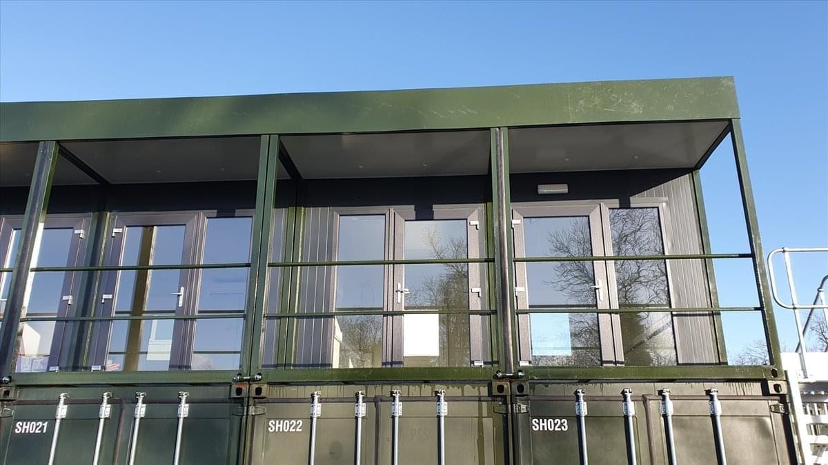 Exterior view of the modular Sterling Office Space c/o Sterling Self Storage with glass balcony doors.