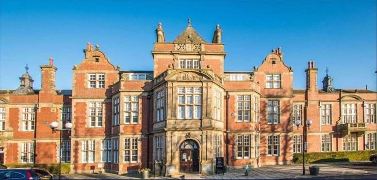 Grand brick exterior of The Fleming showing its historic facade and central entrance.