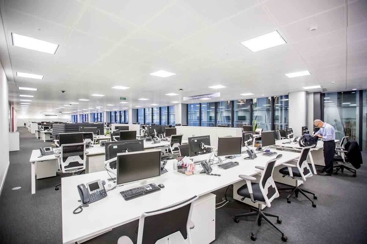 Spacious open-plan workspace at The Walbrook Building, Cannon Street, London with modern desks and large windows.