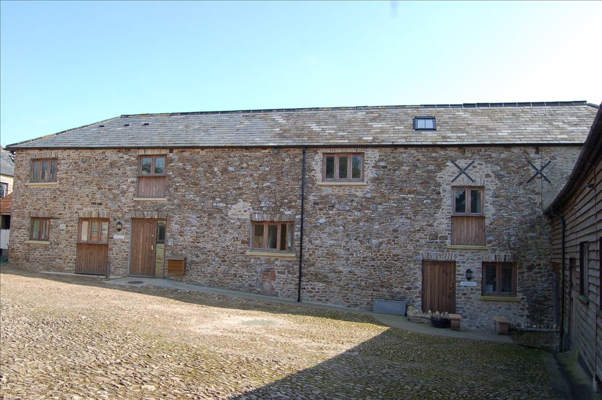 Exterior of the stone-built converted barns at Woodhayes, Luppitt 3-6 The Stable Yard.