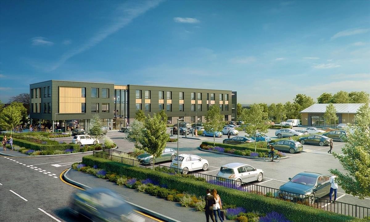 Exterior view of East Northamptonshire Enterprise Centre with large parking area.