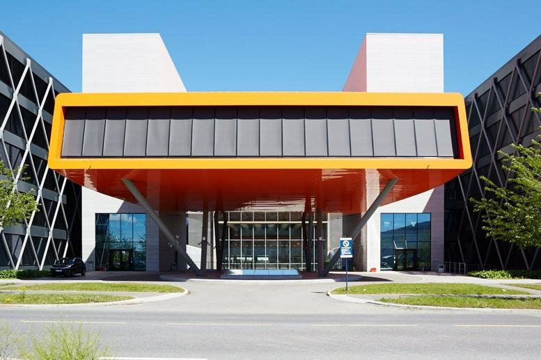 Exterior of the modern orange and white building at Martin Linges Vei 25, Oslo, Norway.