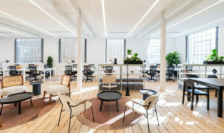 Bright breakout lounge with designer seating and natural light at Nutmeg House, 60, Gainsford Street