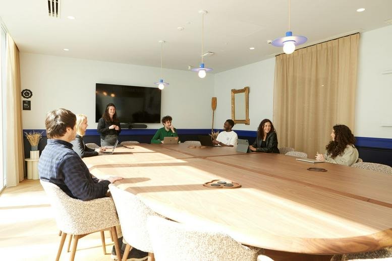 A professional meeting room at 179 Avenue Charles de Gaulle, Neuilly-sur-Seine, Hauts-de-Seine with a large wood table.