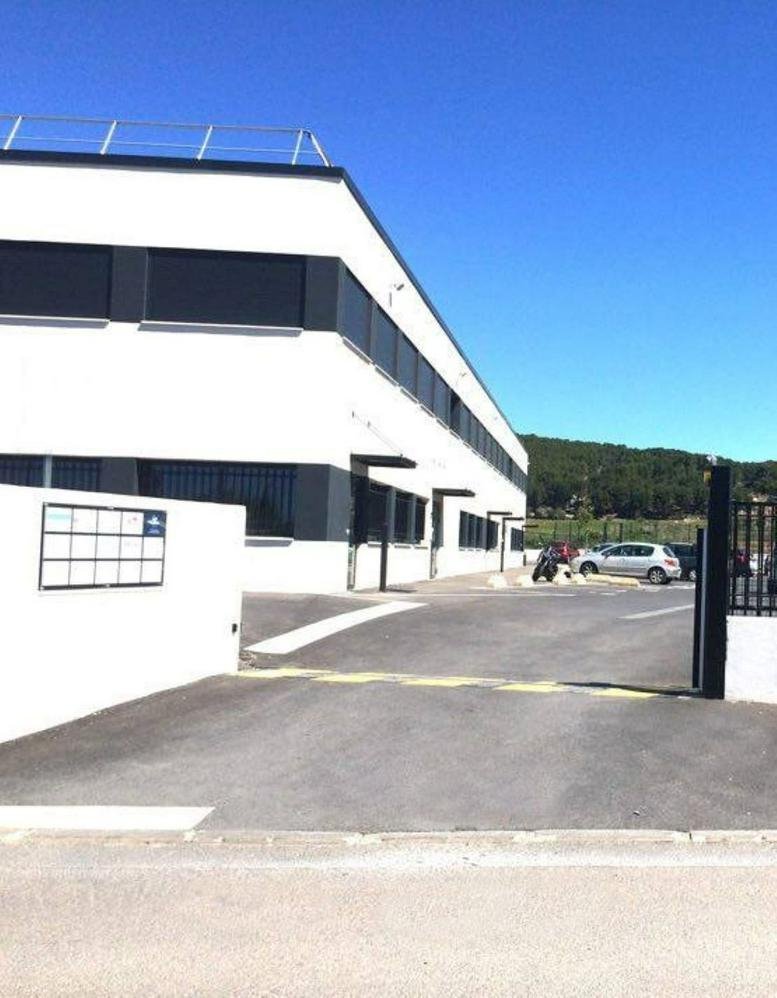 Exterior view of the modern white and charcoal facade at 190 Rue Topaze, Eguilles, Bouches-du-Rhone.