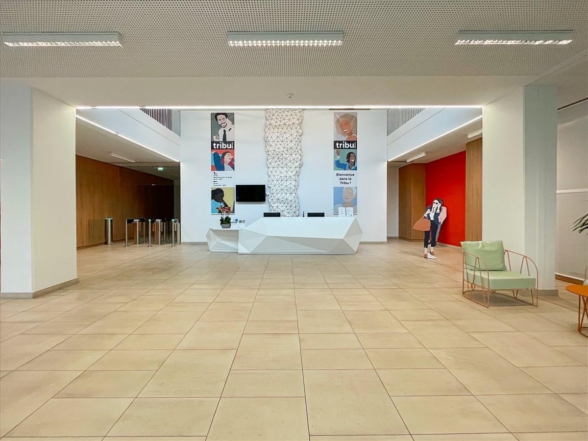 Wide view of the modern lobby and reception area at the 198 Rue d’Aubervilliers, Tribu Building, Paris.