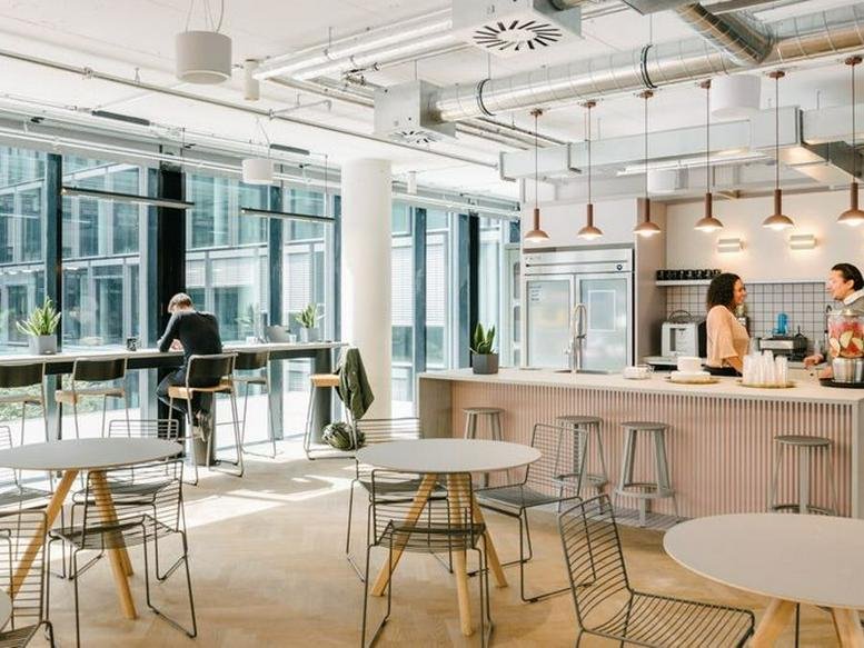 Spacious communal breakout area and kitchen at 20 bis rue La Fayette, Paris, France.