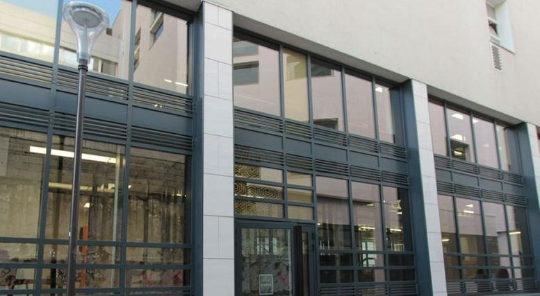 Modern exterior of 21 rue Bréguet, Bastille, 11th Arrondissement, Paris featuring a glass and steel facade.