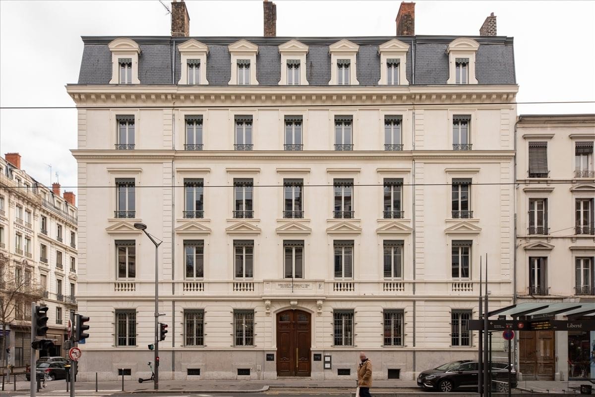 Exterior view of the historic stone building at 41 Cours de la Liberté.