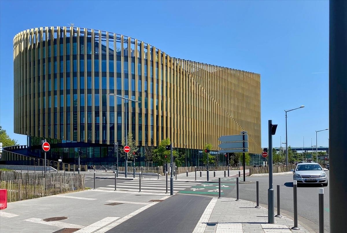 Exterior view of the contemporary glass-facade 594 Avenue Willy Brandt building in Lille.