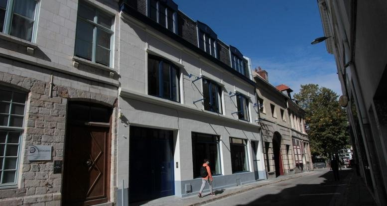 Exterior facade of the historic stone and white plaster building at 68 rue Saint Etienne, Lille, Nord.