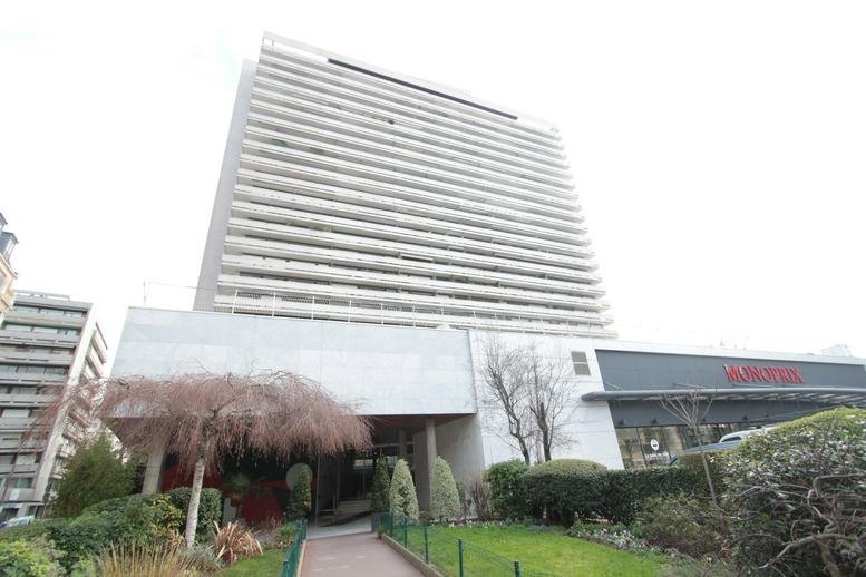 Exterior view of the high-rise tower at 83 Avenue d'Italie, Tolbiac District, Paris.