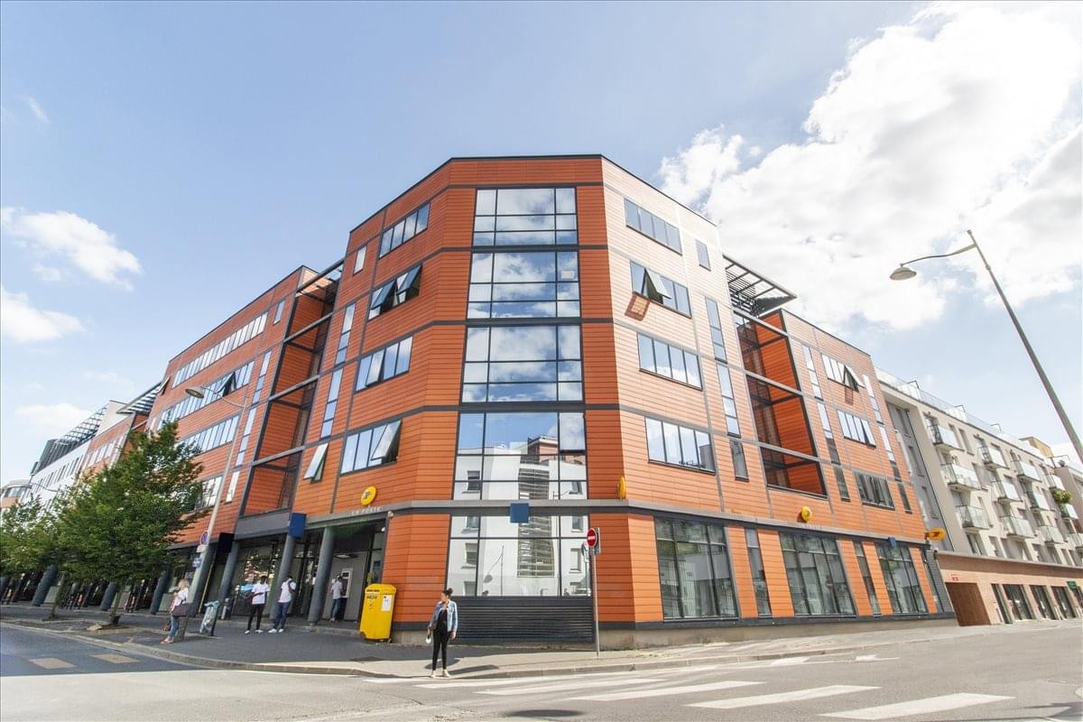 Exterior view of the modern red-brick facade at 9- 11 rue Gaston Boyer, Reims, Marne.