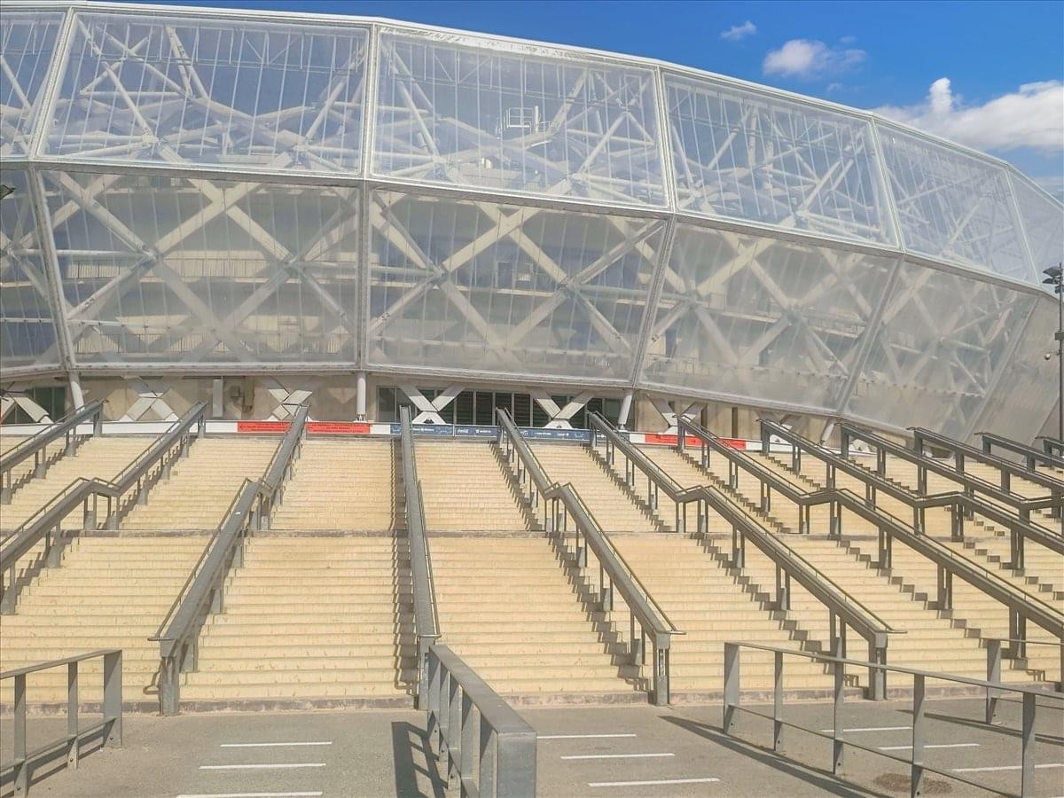 Exterior view of the striking geometric white lattice facade at the Allianz Riviera building.