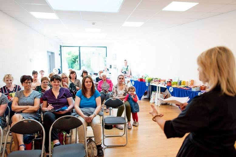 Spacious workshop or presentation room at Chaussée De Lille 479/2, Tournai with a seated audience and a speaker.