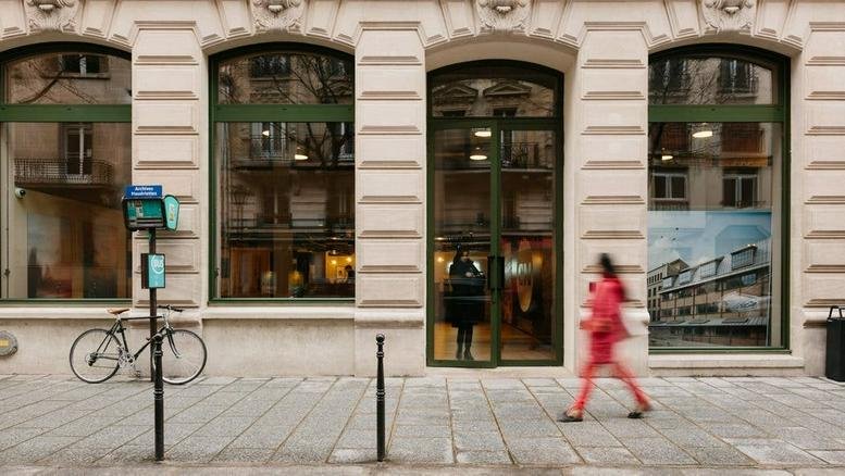 Exterior view of the arched windows and stone facade at Collines de l’Arche.