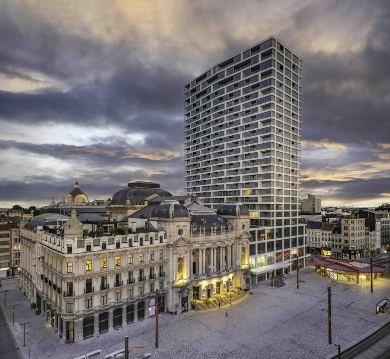 Exterior view of the landmark tower and theater building at Frankrijklei 5, Antwerp.