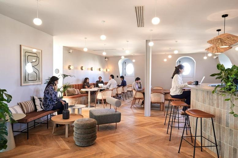 Spacious lounge at the Grand Marnier Building, 91 Boulevard Haussmann, with herringbone floors and natural light.