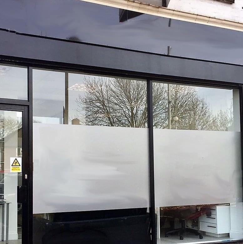 Exterior storefront view of 21 Stonecot Hill, North Cheam, Sutton featuring large windows with privacy film.