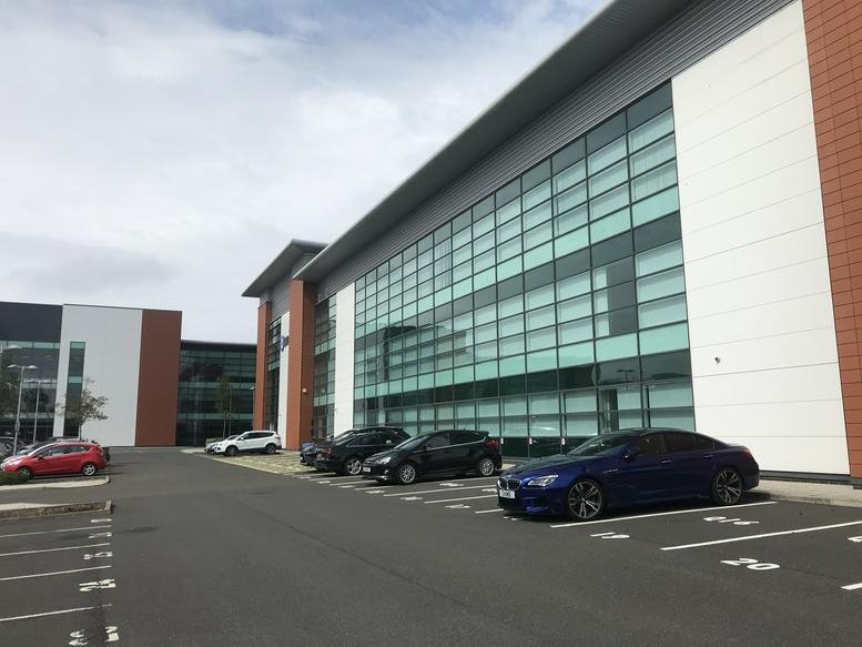 Exterior view of the modern glass-fronted Q16 Workspace, Quorum Business Park building.