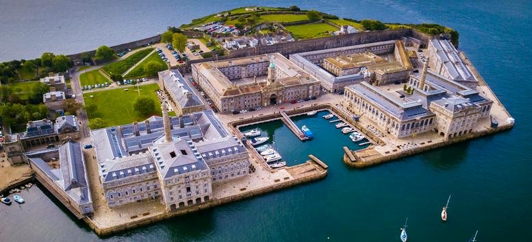 Aerial view of the Royal William Yard, Melville Building, BLOCK surrounded by water.