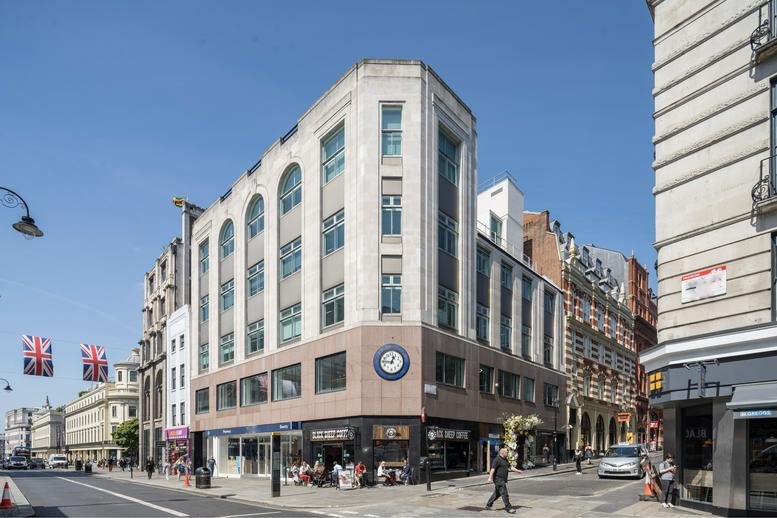 Exterior view of the white and brown stone facade at 1 Bedford Street, 3rd & 4th Floor.