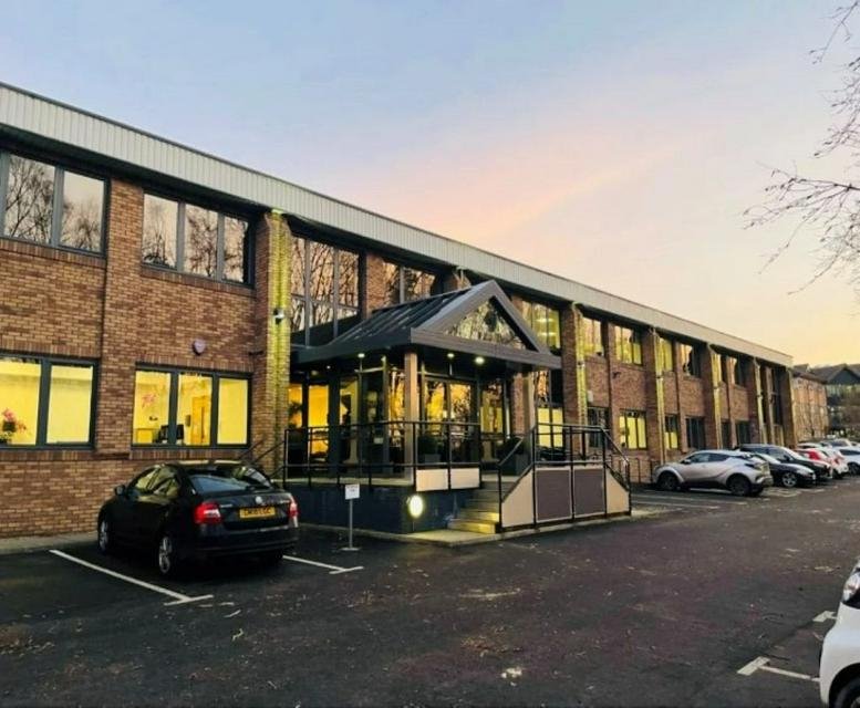 Exterior view of the brick facade and entrance at 1 Cardale Park.